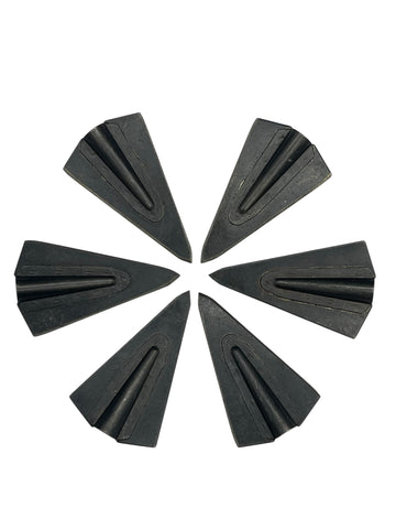 A set of six Tusker Delta glue-on broadheads arranged on a white background in a circular pattern